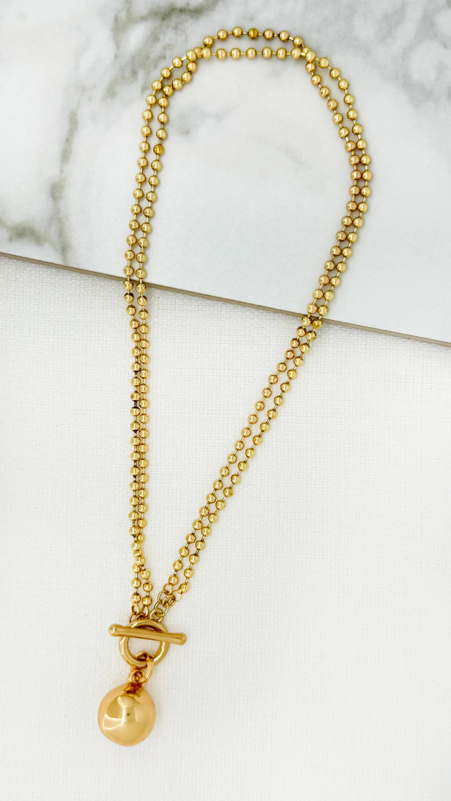 Short double T-bar necklace with T-bar and ball pendant